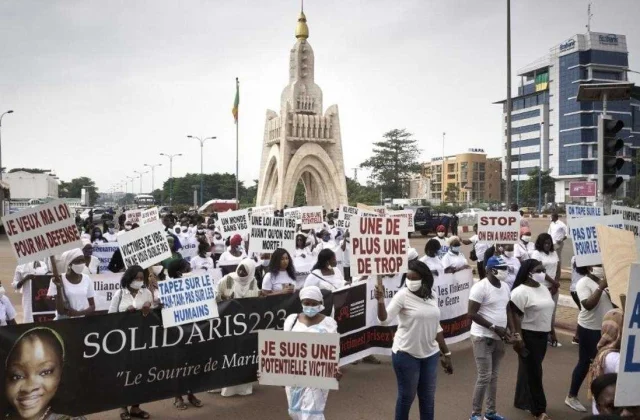hundreds of people march against violence against women