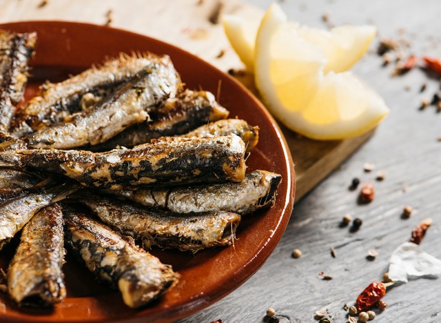 40 suggestions for males who need to lose weight after 40 219 grilled sardines on plate with lemon wedge