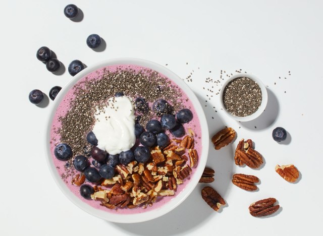 acai blueberry smoothie bowl on white background