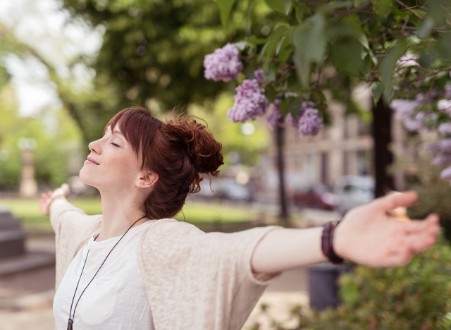 happy woman with her arms outstretched