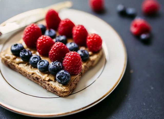 berries on peanut butter toast