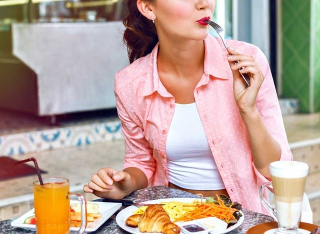 woman eating with fork