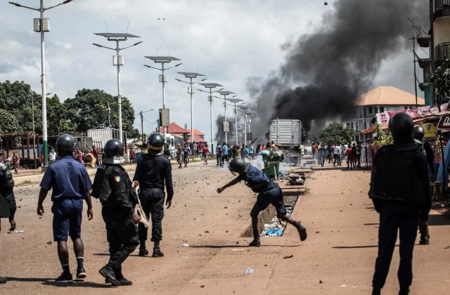Violence after the election in Guinea turns into lethal as police conflict with opposition supporters