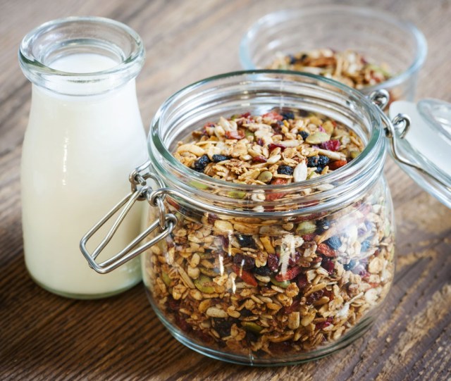 jar of granola with milk glass