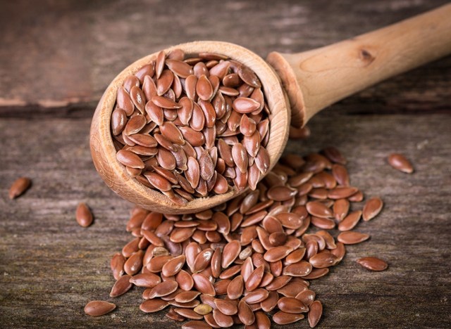 lose your intestine: 50 meals that assist soften stomach fats 263 flax seeds in a wooden spoon