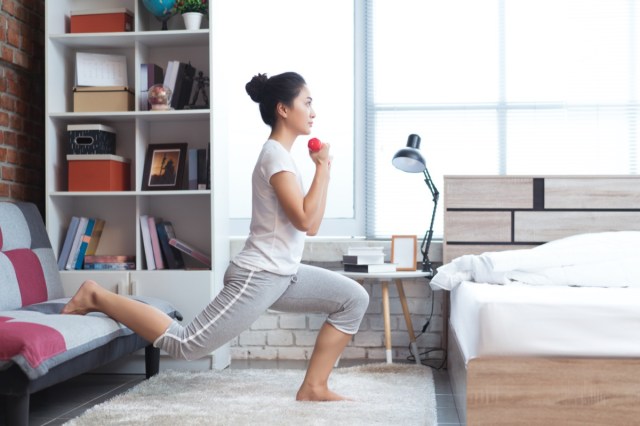 asian women exercising in bed in the morning