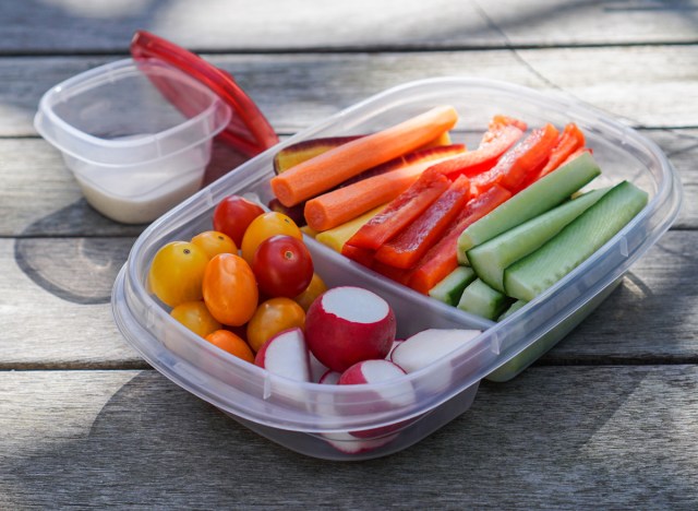 pre-cut vegetables carrots peppers cucumbers radishes tomatoes in containers for meal for light snack