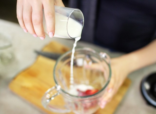 pour the nut milk option into the smoothie in a blender