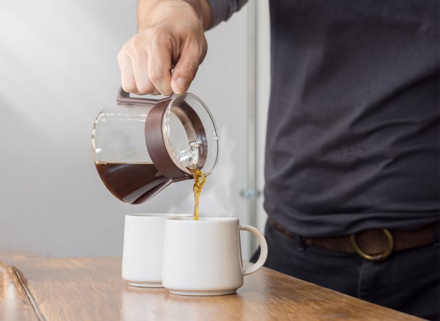 coffee pot pour into two cups