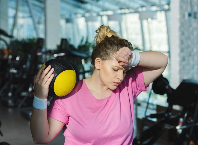 woman sweating and tired after exercise