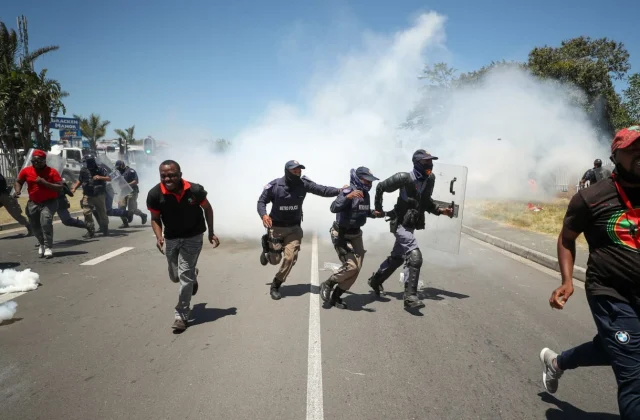 South African police fire tear gas at protesters against racism