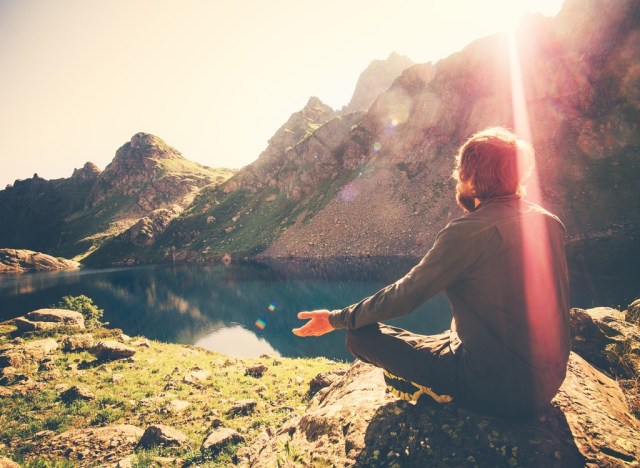 man meditating outdoors