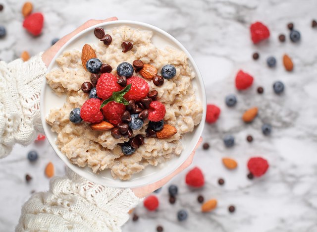 bowl of oatmeal with peanuts and chocolate