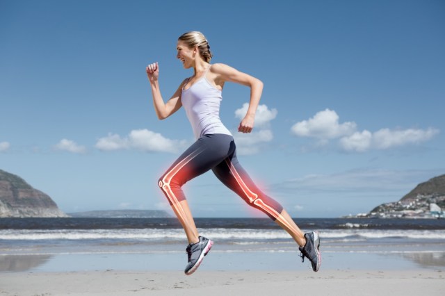 digital composite of highlighted leg bones of jogging woman on the beach