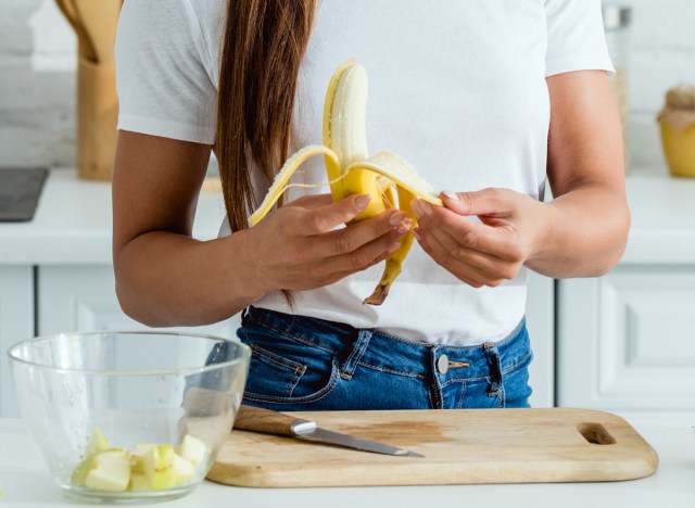 woman peeling banana