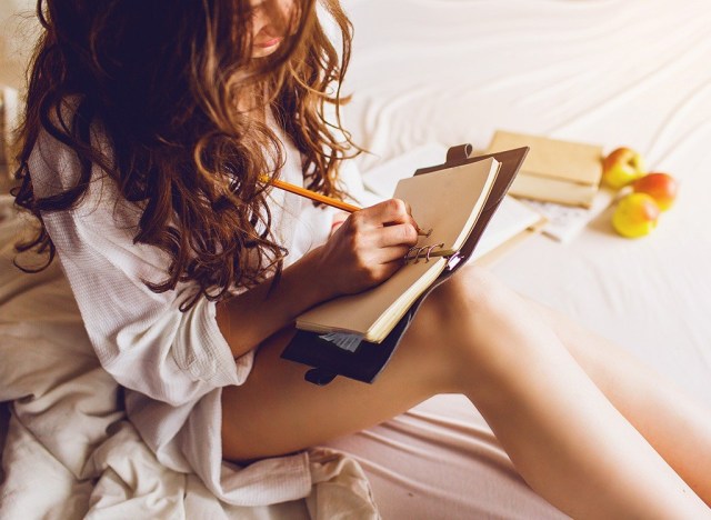 woman writing in journal