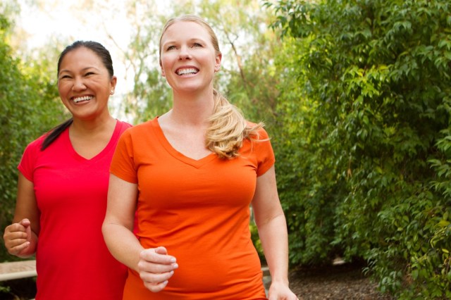 women walking and exercising smilling and happy