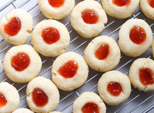 close up of thumbprint cookies on a cooling rack