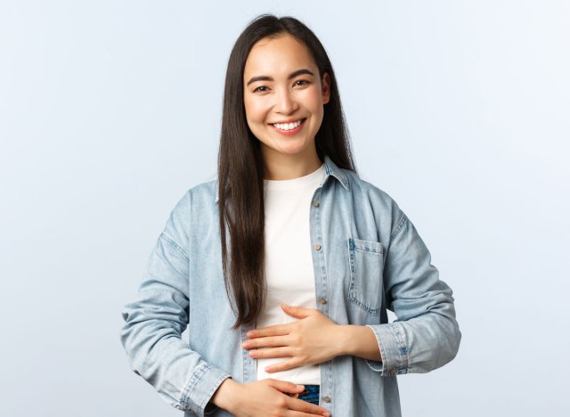 happy woman hands on belly