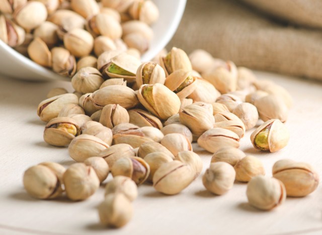 pistachio almonds falling out of the bowl