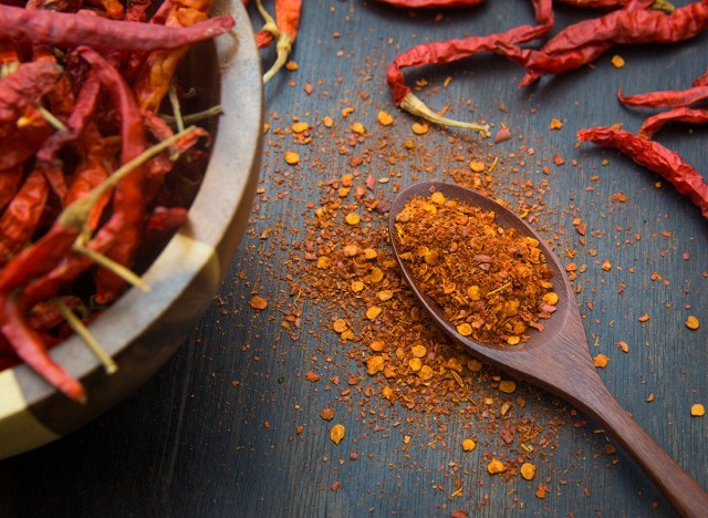 40 weight loss tips that help you drop more pounds 178 cayenne pepper on wooden spoon and table