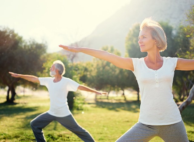 older couple doing yoga