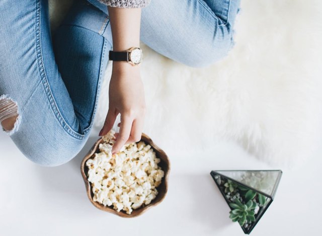 woman eating popcorn