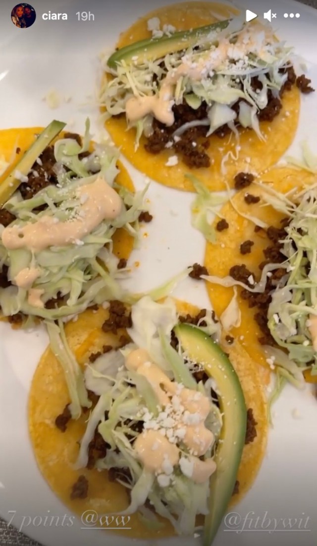 plate of tacos with salad and avocado