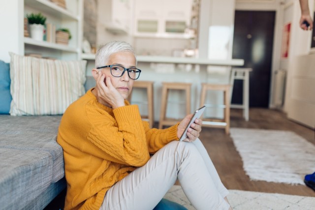 portrait of a worried mature woman having problems with her finances