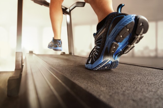 what you stroll on a treadmill does on your physique, say 32 man running in a gym on a treadmill concept to exercise, fitness and healthy lifestyle
