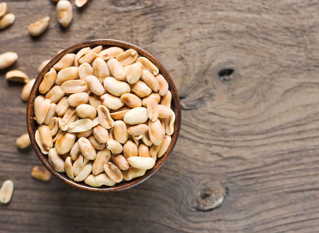 roasted peanuts with salt in brown bowl