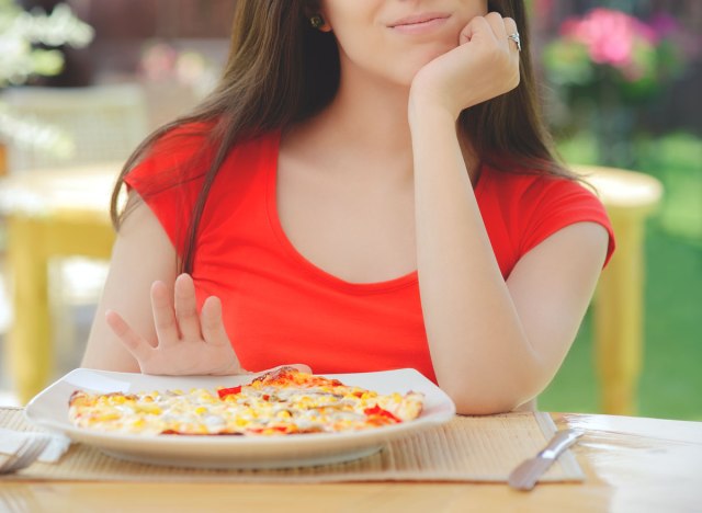 woman doesnt want to eat pizza skips meal