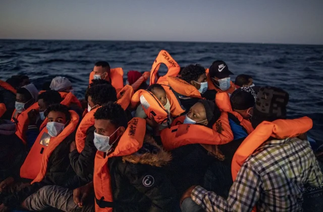Migrants compete to avoid Libyan coastguard to reach