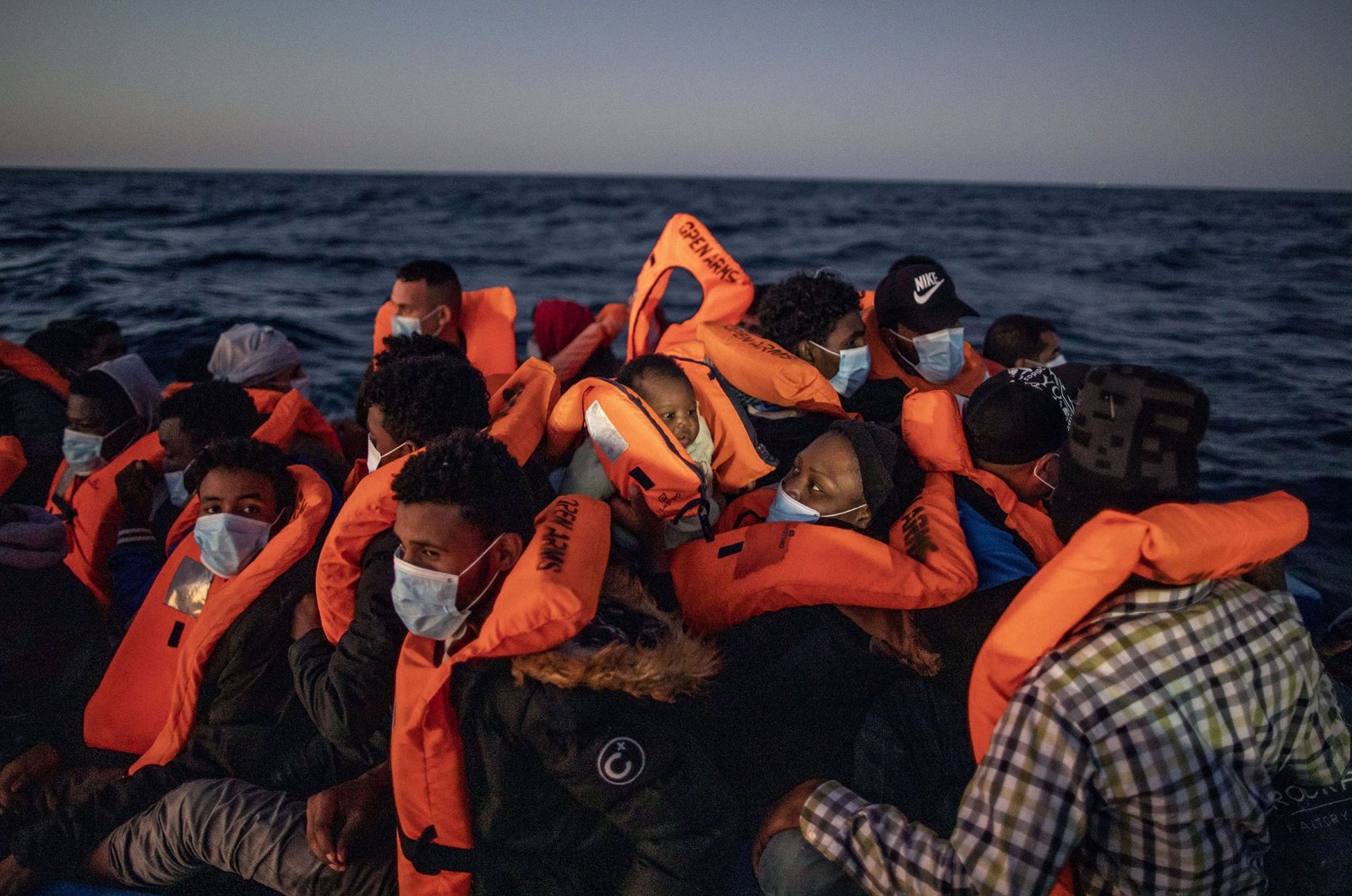 Migrants compete to avoid Libyan coastguard to reach