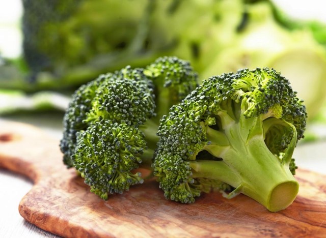 broccoli on a wooden cutting board