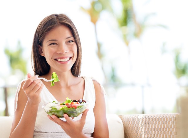 woman eating salad