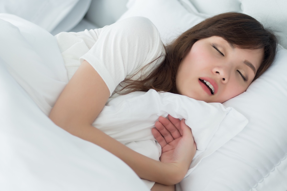 13 issues that take place after you lose 5 kilos 68 woman sleeping in bed with white sheets