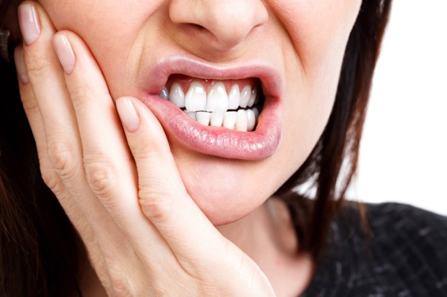 woman with a toothpain.