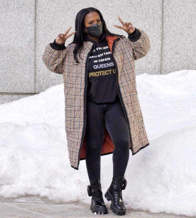 kandi burruss in burberry coat, black leggings, black sweater and black mask flashing peace