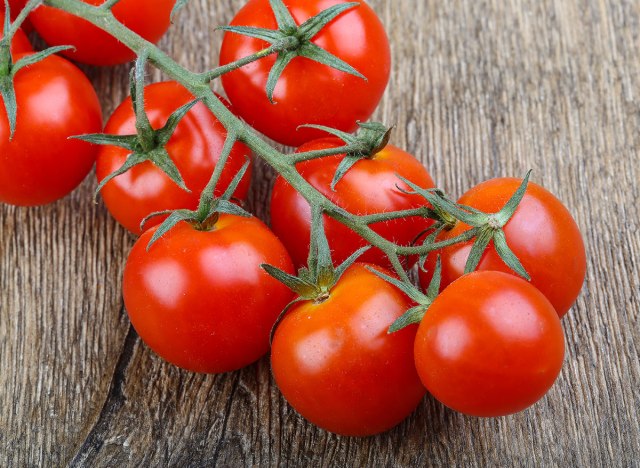 tomato bunch on wood