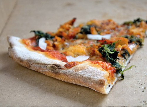 pizza slice leftover in box