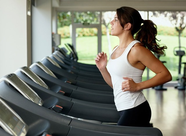 woman running on treadmill - best ways to speed up your metabolism