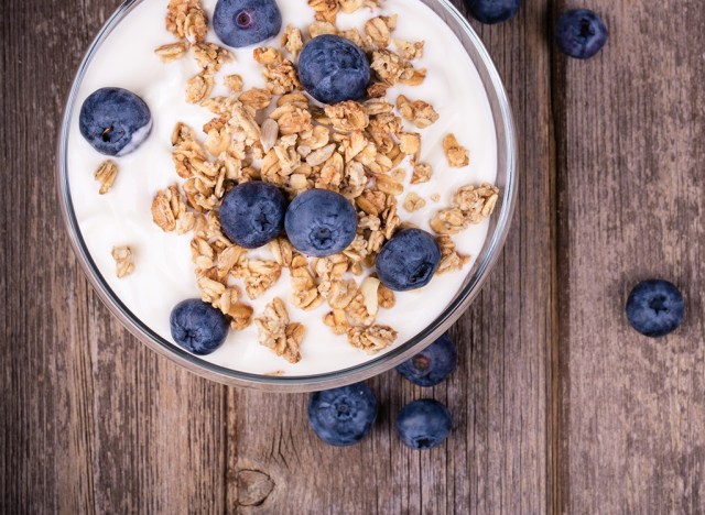 yogurt in bowl with granola and blueberries - best ways to speed up your metabolism 