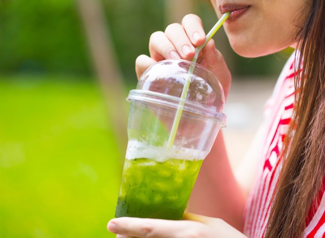 woman drinking iced green tea