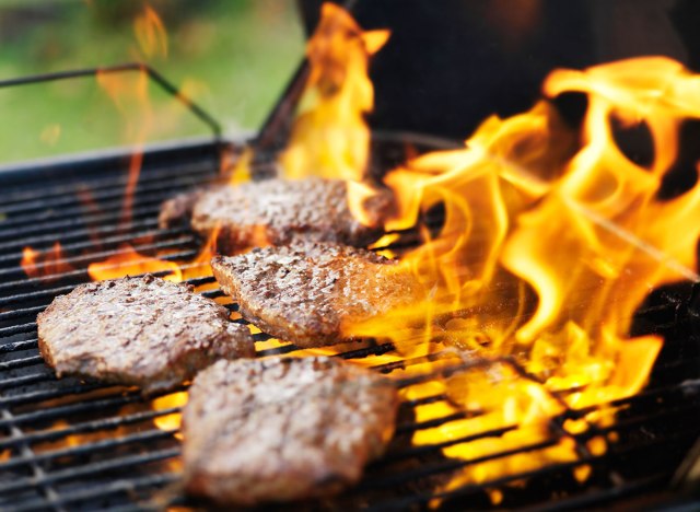 grilled burger surrounded by flare ups