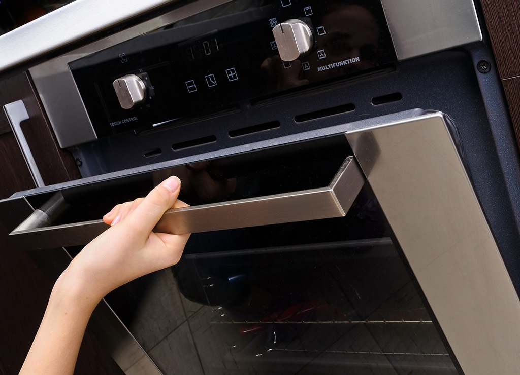 the 30 worst cookie mistakes you're making 174 woman opening oven