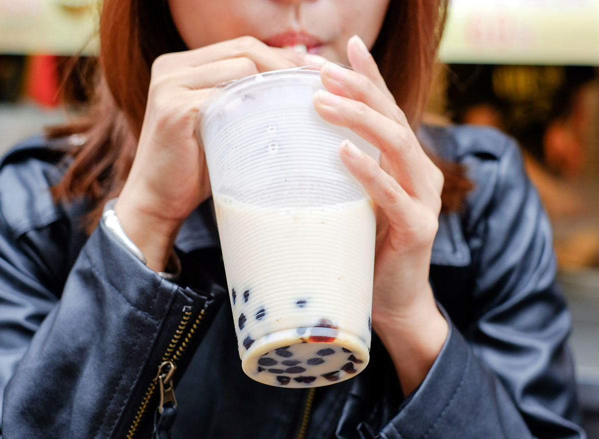 woman sipping bubble tea