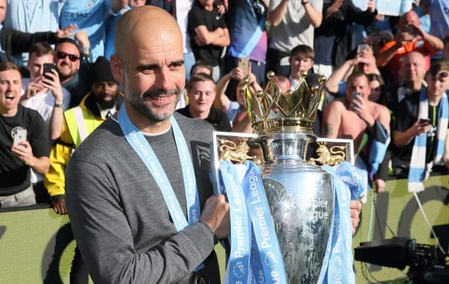 What number of trophies has Pep Guardiola gained?