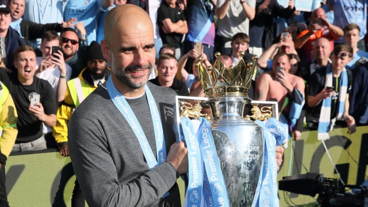 What number of trophies has Pep Guardiola gained?