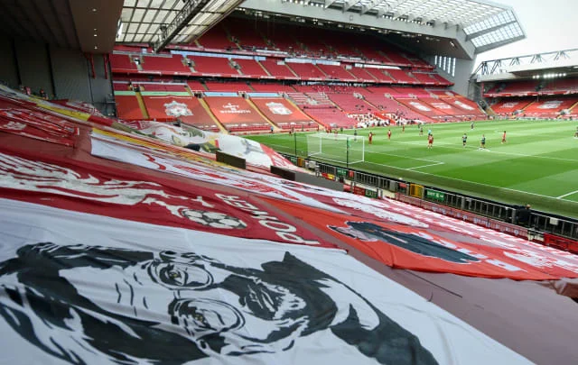 Liverpool fan protests by removing Kop flags